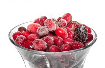 Frozen berries in a bowl isolated on white background