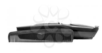 Hair clipper and comb isolated on white background