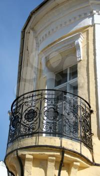Old building with an iron balcony. Courtyard of Spaso-Prilutsky Monastery in the Vologda city, Russia. Summer sunny day