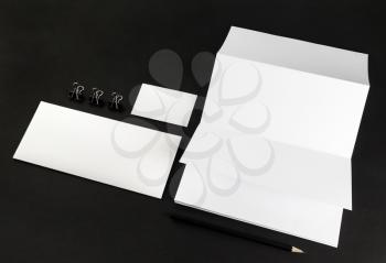 Corporate identity template on black background. Photo of blank stationery. For design presentations and portfolios. Mock-up for branding identity.
