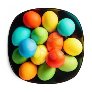 Colored Easter eggs on a black plate on white background. Isolated with clipping path.