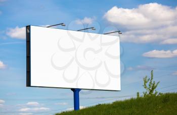Blank billboard on blue sky background. Street poster. For design presentations and portfolios.