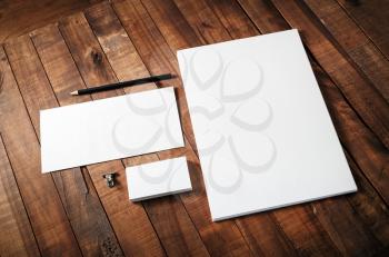 Blank corporate identity template on wooden table background. Blank template for design portfolios. Mock-up for your design. Blank stationery set.