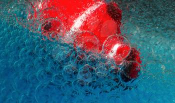 Abstract bubbles on a blue background and a fragment of a red fish. Colorful macro photo of soap bubbles. Can be used for background.
