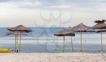Group of straw umbrellas on the Black Sea in Bulgaria.