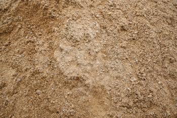Sand texture closeup. Coarse sand grains background.
