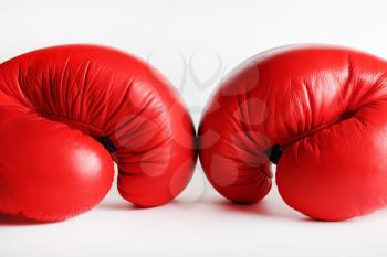 A pair of red boxing gloves. Sports concept.