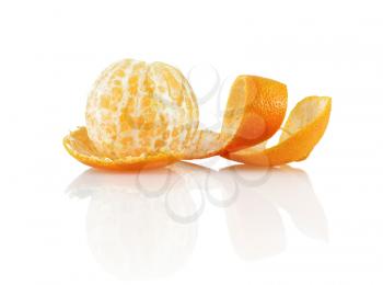Delicious sweet juicy clementine. Peeled mandarin and peel on a white background with reflection. Isolated on white background.