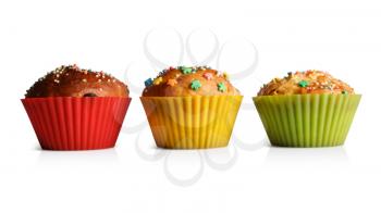 Delicious cupcakes in colorful molds for baking. Clipping path.