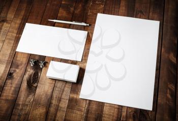 Photo of blank stationery set on vintage wooden table background. Mockup for branding identity. Blank branding identity set. Identity template. For designers portfolios.