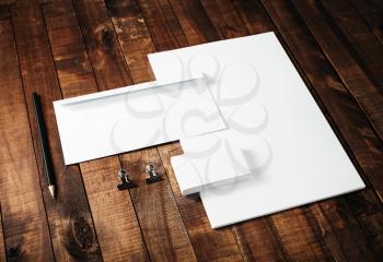Blank corporate identity template on vintage wooden table background. Blank stationery mock-up. For design portfolios.