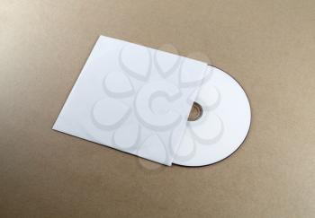 Blank compact disk on a table. Template for branding identity for designers.