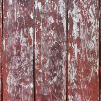 Grungy wooden background with peeling paint. Old wood texture.