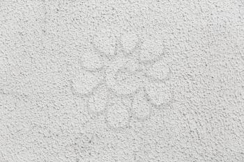 Cement wall painted in a light gray color. Abstract plaster texture background.
