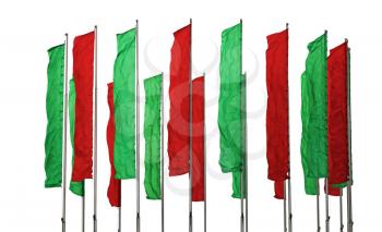 Several flagpoles with vertical green and red flags
