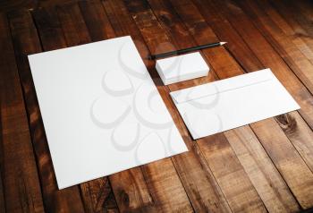 Mockup for ID. Blank branding template on vintage wooden table background. Mock-up for design presentations and portfolios.