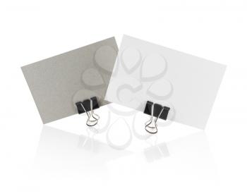 Two blank business card isolated on white background with reflection. Clipping path.