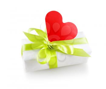 Gift box with a satin ribbon and a red paper heart. Isolated with clipping path on white background.