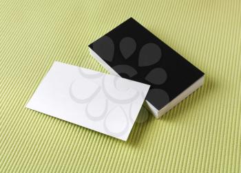 Set of blank business cards on a green background.