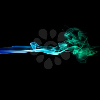 Abstract bright blue and green smoke on a dark background.