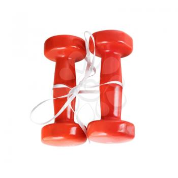 Two red dumbbell. Red dumbbells tied with satin ribbon. Isolated with clipping path on white background. Top view.