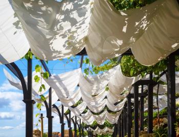 White cloth canopy from the sun in a recreation area outdoor.