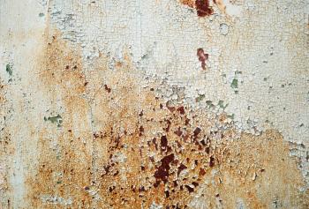 Abstract vintage texture. Old peeling paint with cracks and rust spots. Grunge background.