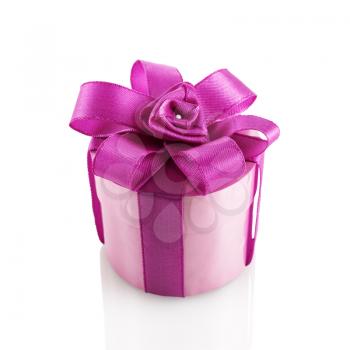 Purple festive gift box with ribbon and bow on a white background. Isolated with clipping path.