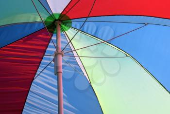 Close-up of bright colorful parasol. Detail of multicolored umbrella. 