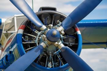 View of the propeller aircraft closeup. Shallow depth of field.