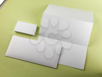 Blank stationery set on a green background. Template for branding identity. 