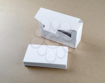 Photo of packing box with blank business cards and a stack of business cards.  Blank mock-up for design presentations and portfolios.