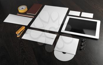 Blank stationery and corporate id template on wooden background.