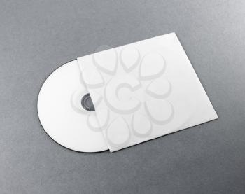 Blank compact disk on gray background. Mockup for branding identity for designers.