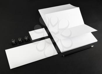 Photo of blank stationery and corporate id template on black background. Mock-up for branding identity.