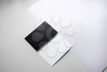 Black and white business cards for presentation of corporate identity. Top view.