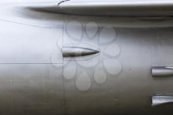 Abstract weathered silver metallic background. Metal texture. Fragment of the old airplane sheathing fuselage.