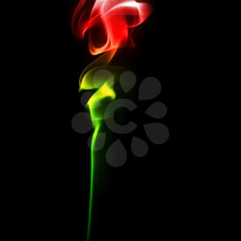 Abstract bright colored smoke on a dark background. Smoke rose from.