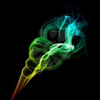 Abstract bright multicolored smoke on a dark background.