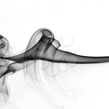 Photo of abstract black smoke swirls over white background.