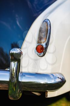 Back view of classic vintage car. Close-up of retro classic car. Shallow depth of field. Selective focus.