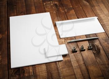 Corporate identity mock up on wooden table background. Blank stationery template. Blank letterhead, business cards, envelope and pen. Responsive design mock-up for branding identity.