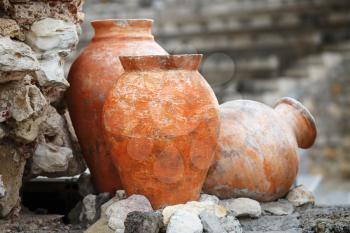 Old ancient clay vases outdoors. Still life of ceramic pots. Shallow depth of field. Selective focus.