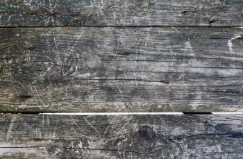Old wooden background. Rustic weathered barn wood texture with knots.