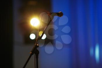 Microphone on the rack in the concert stage. Shallow depth of field. Selective focus.