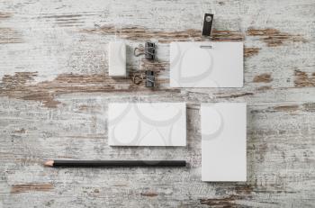 Blank stationery set. Corporate identity template. Mock-up for branding identity for designers. Bank business cards, badge, pencil and eraser on vintage wooden table background. Top view.