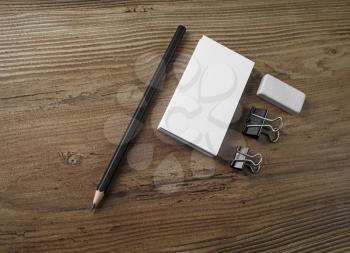 Bank business cards, pencil and eraser on wooden background.