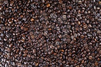 Roasted coffee beans background. Brown coffee beans texture.Top view