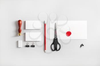 Photo of blank stationery set on paper background. Responsive design mockup for placing your design. ID template. Top view.