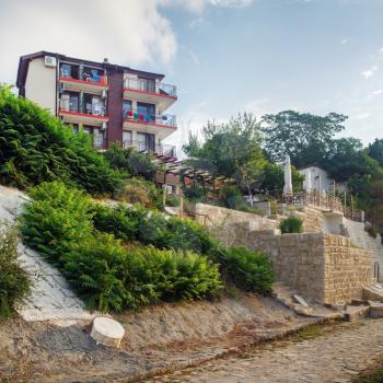 Nesebar, Bulgaria - September 05, 2014: Architecture, and cobbled stone pavement in Old town Nesebar. Seaside resort Nessebar. Bulgarian Black Sea Coast. Architectural and Historic Complex. UNESCO wor